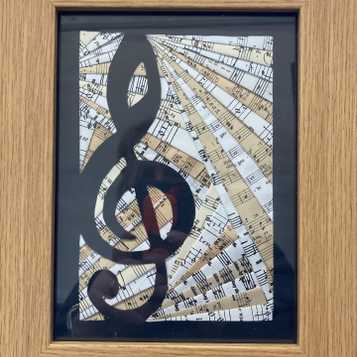 Iris folding technique using recycled music paper and drawn musical note