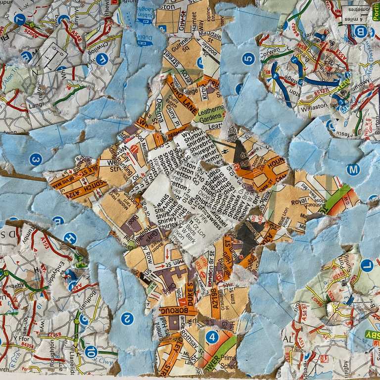 Collage using torn pages from a map