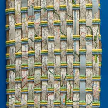 Weaving using old map paper and wool on cardboard