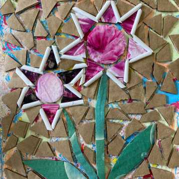 Flower mosaic design using recycled cardboard and magazines on marbled base