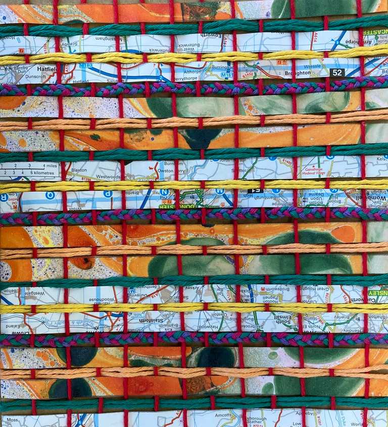 Weaving using old map paper and wool on cardboard
