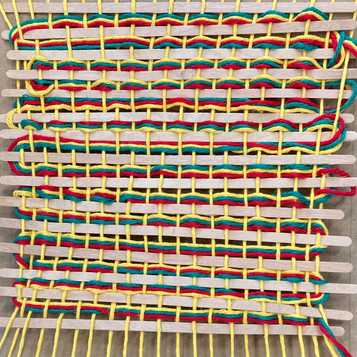Wooden stirrers and wool weaving